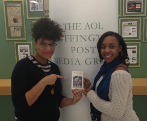Julee Wilson and Taylor Griffith holding a picture of "The Giant"